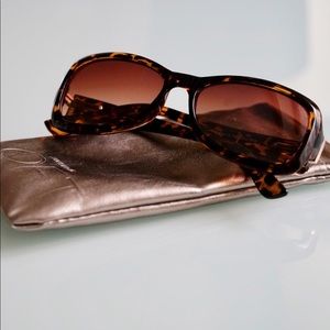 Leopard print sunglasses and protective sleeve